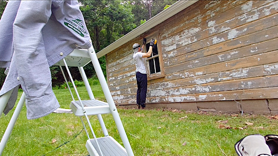 Thoughtful wood garage painting and exterior wood restoration in progress