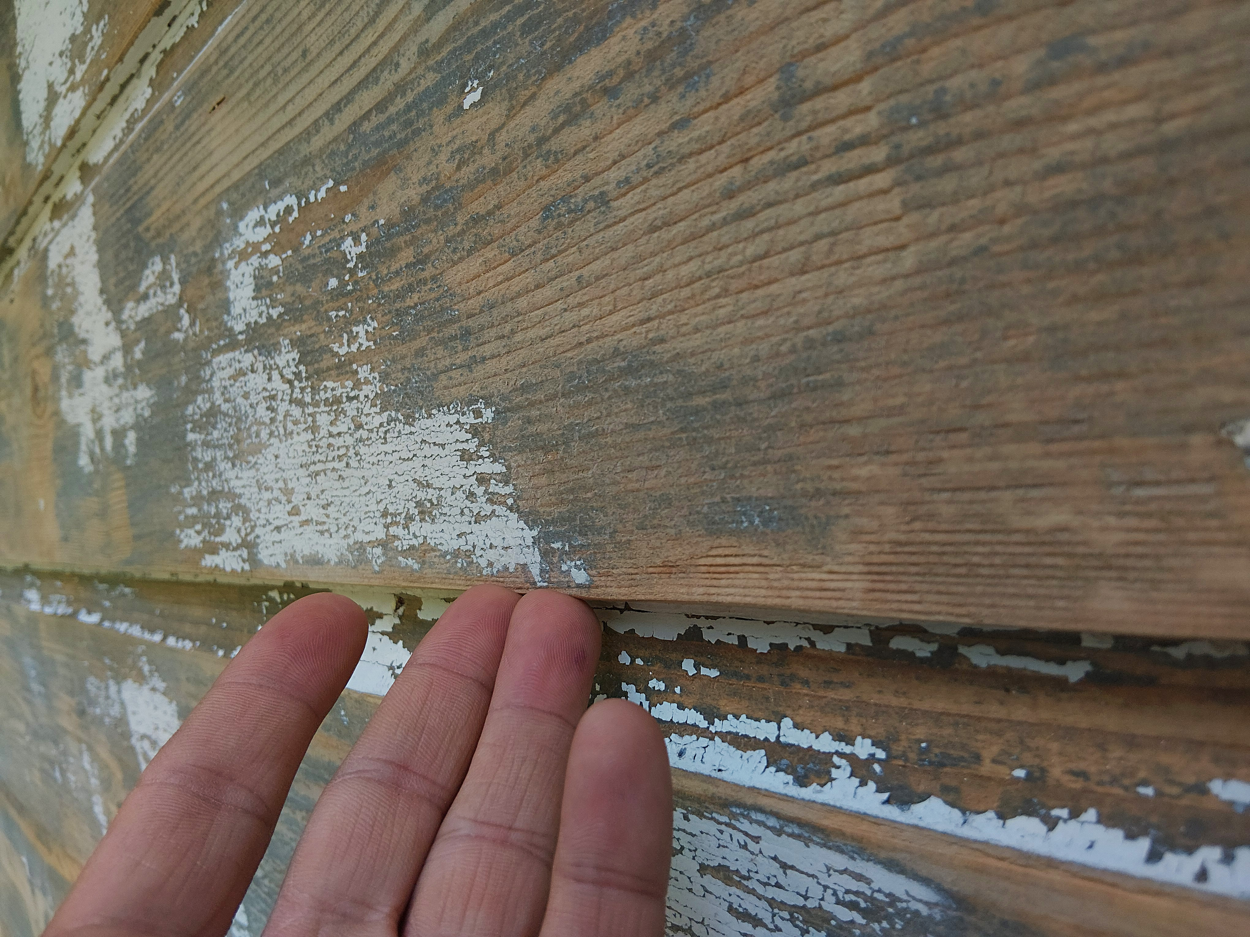 Smooth to the touch weathered garage wood after careful scraping and sanding